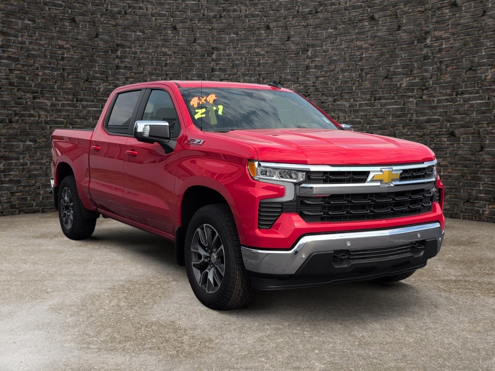 2026 Chevrolet Silverado 1500 LT in Red Hot — front three-quarter view